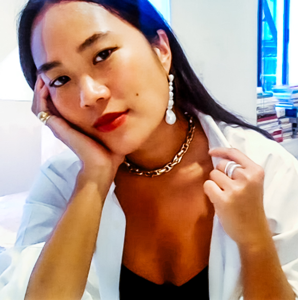 Stylist Beverly Nguyen wears pearl earrings, a gold necklace and rings